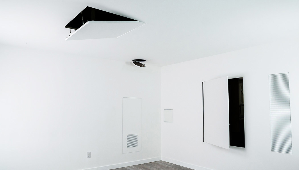 Room that includes access panel examples of BAUCO product lines on each wall and the ceiling